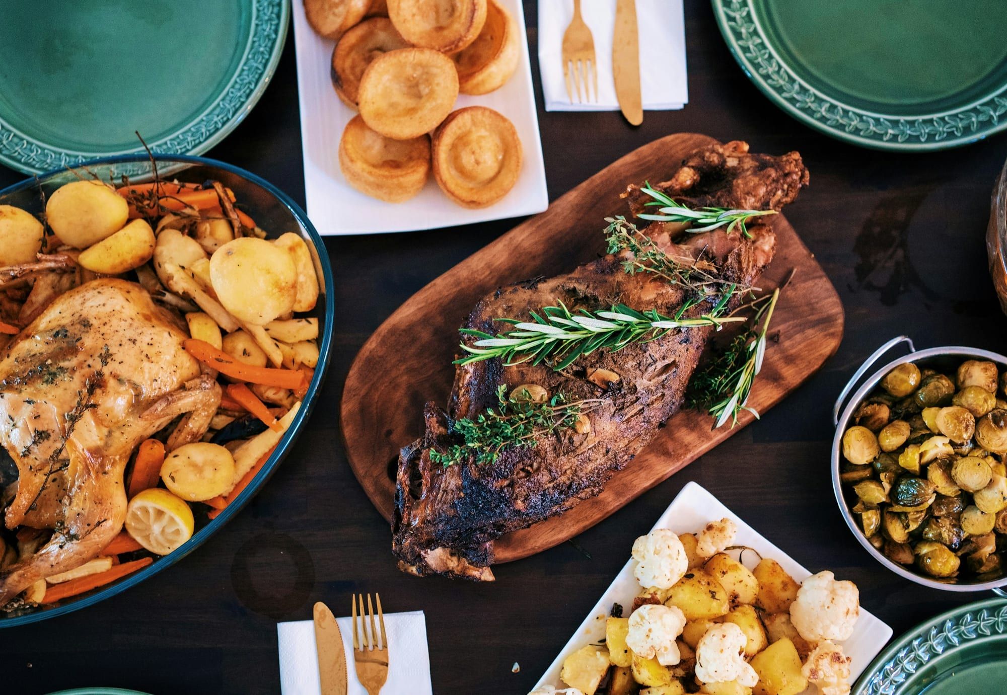 A spread of roasted dishes set for the table